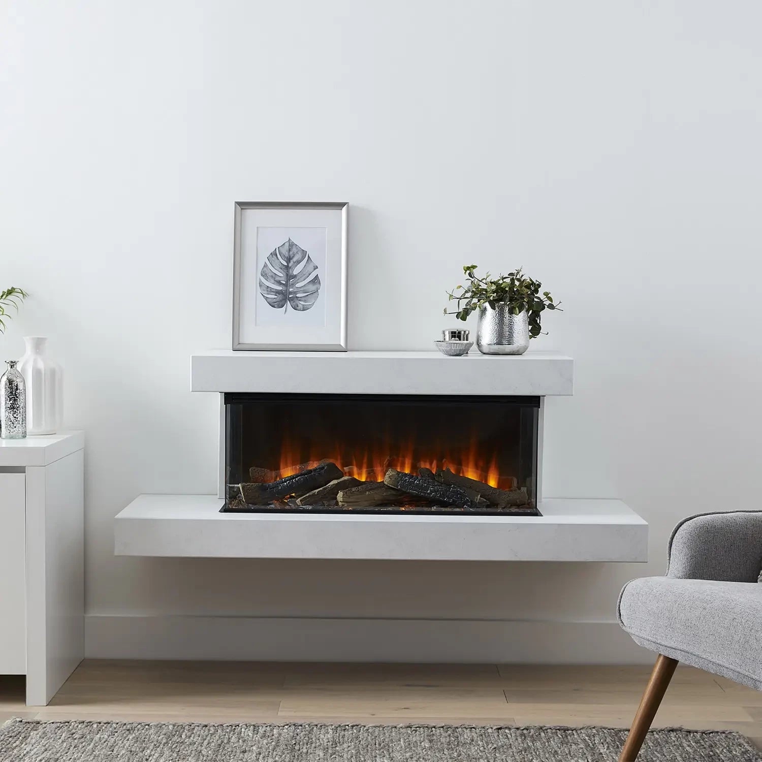 Brockenhurst 1600 White Marble wall-mounted electric fireplace suite with panoramic flame view