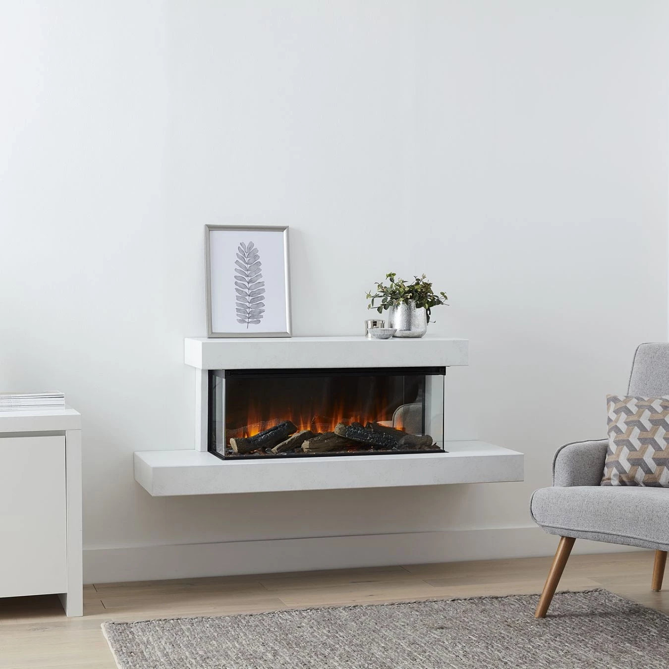 Brockenhurst 1200 White Marble wall-mounted electric fireplace suite with three-sided flame view