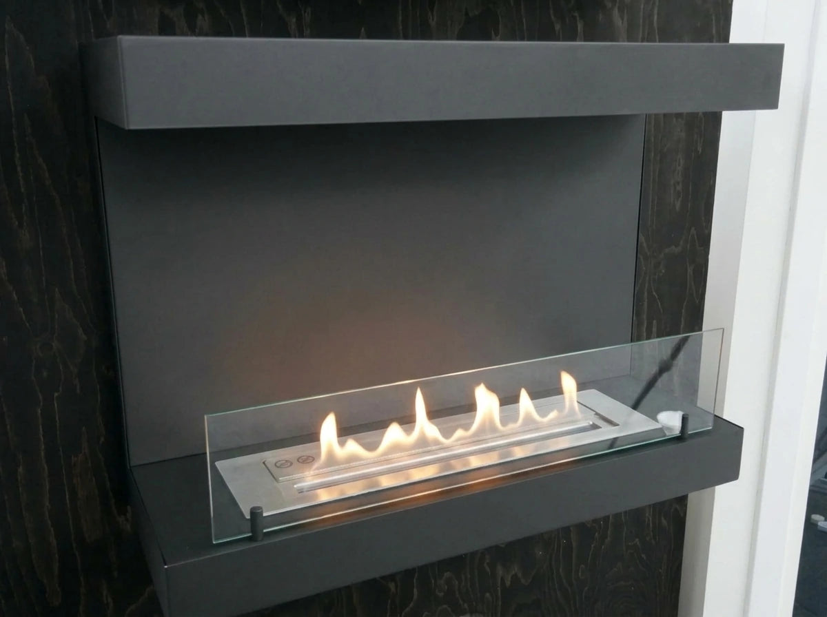 Close-up of the Dakota black three-sided bio fireplace's glass panel and burner tray, lit