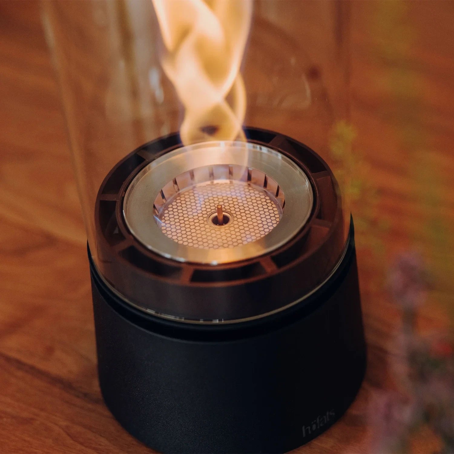 Höfats SPIN Air 900 matte black tabletop fireplace with high cylindrical glass and rotating flame