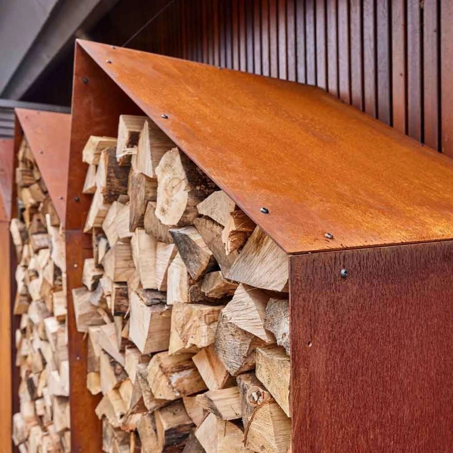 Sheddak 3 Houses Log Storage, a practical and sturdy solution for storing firewood in outdoor spaces like gardens and patios.