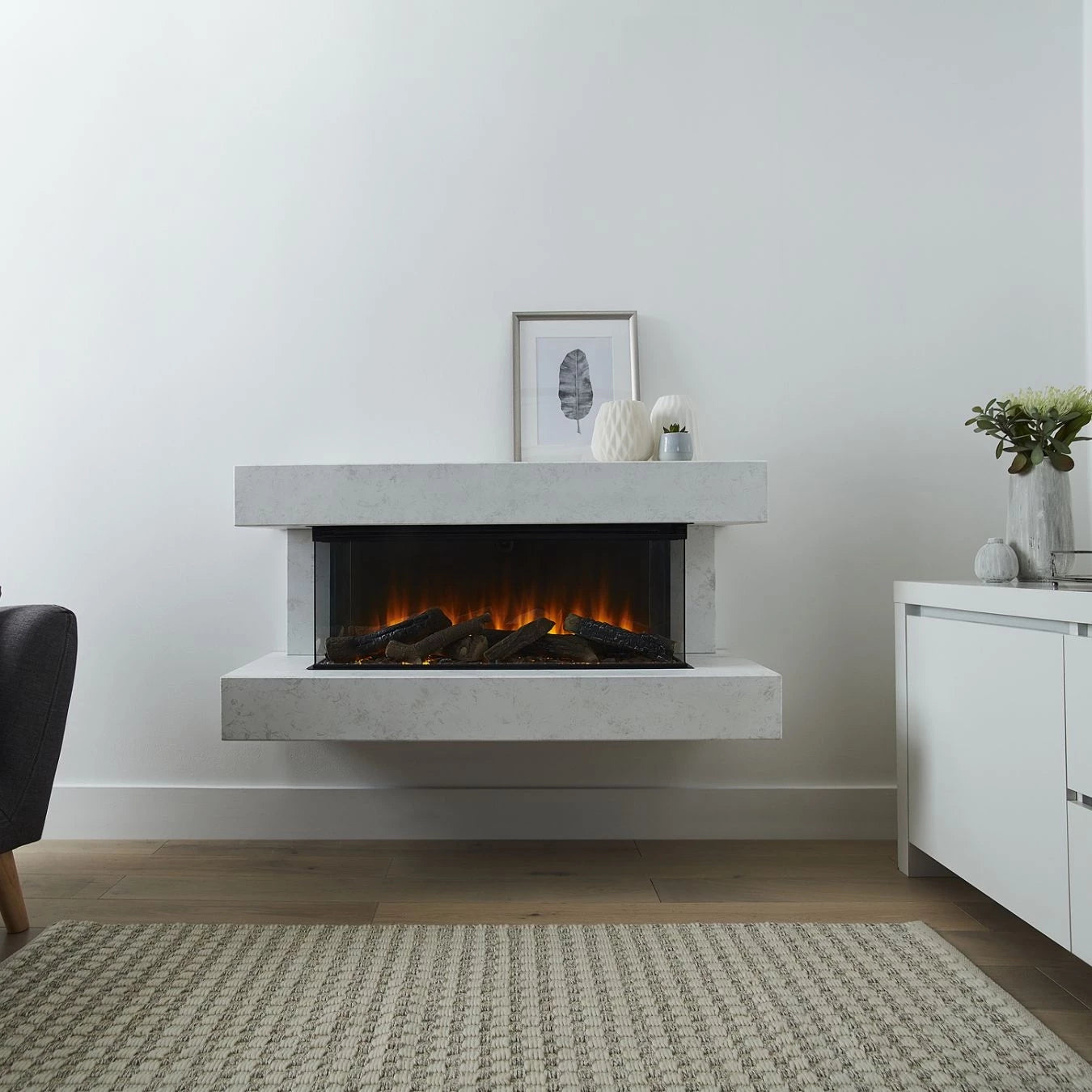 Winchester 870 White Marble wall-mounted electric fireplace suite with mantel and three-sided flame view